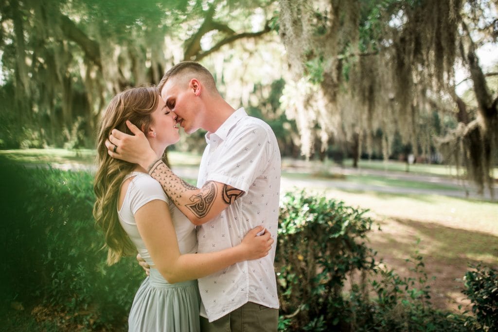 This image contains a lovely couple enjoying an engagement session in Savannah, GA at Bethesda Academy
